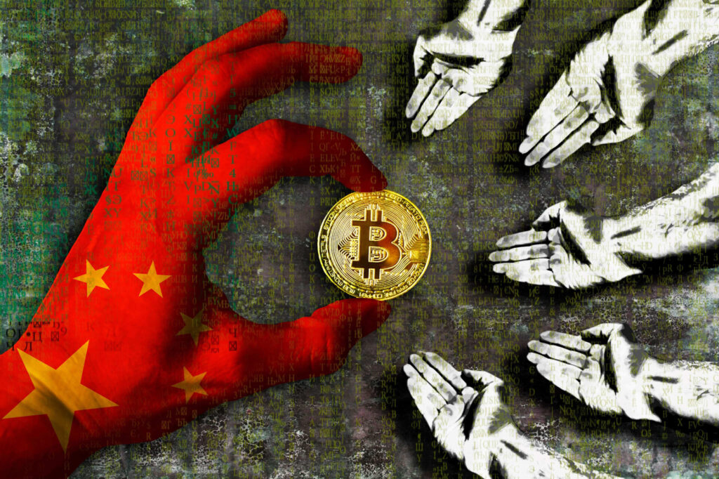 Hand holding Bitcoin with Chinese flag glove on