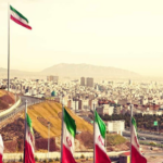 Image of Tehran, Capital City of Iran with Iran flags.