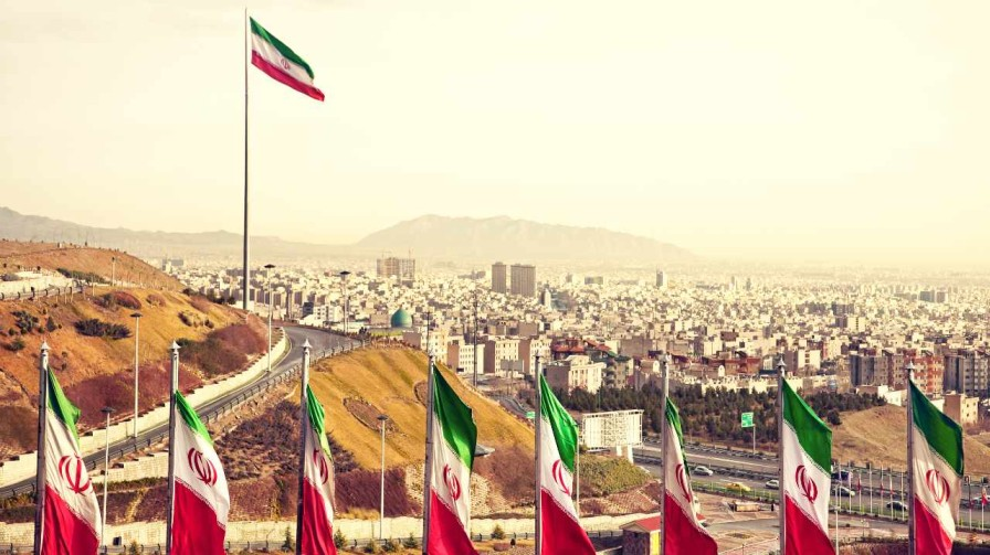 Image of Tehran, Capital City of Iran with Iran flags.