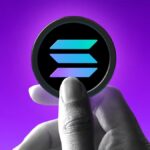 Hand holding Solana token